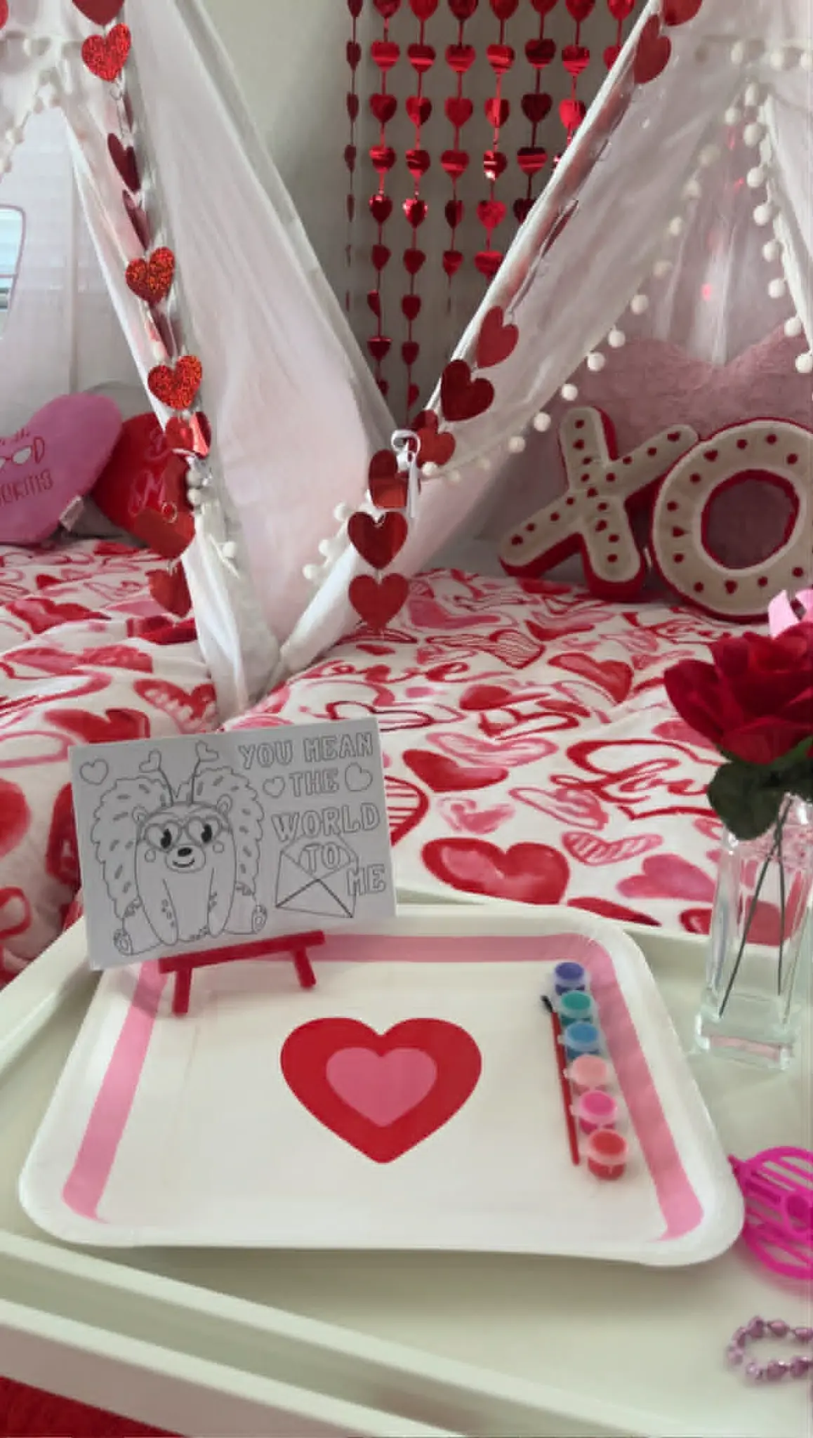 Valentine's Day teepee sleepover with hearts and XO decor