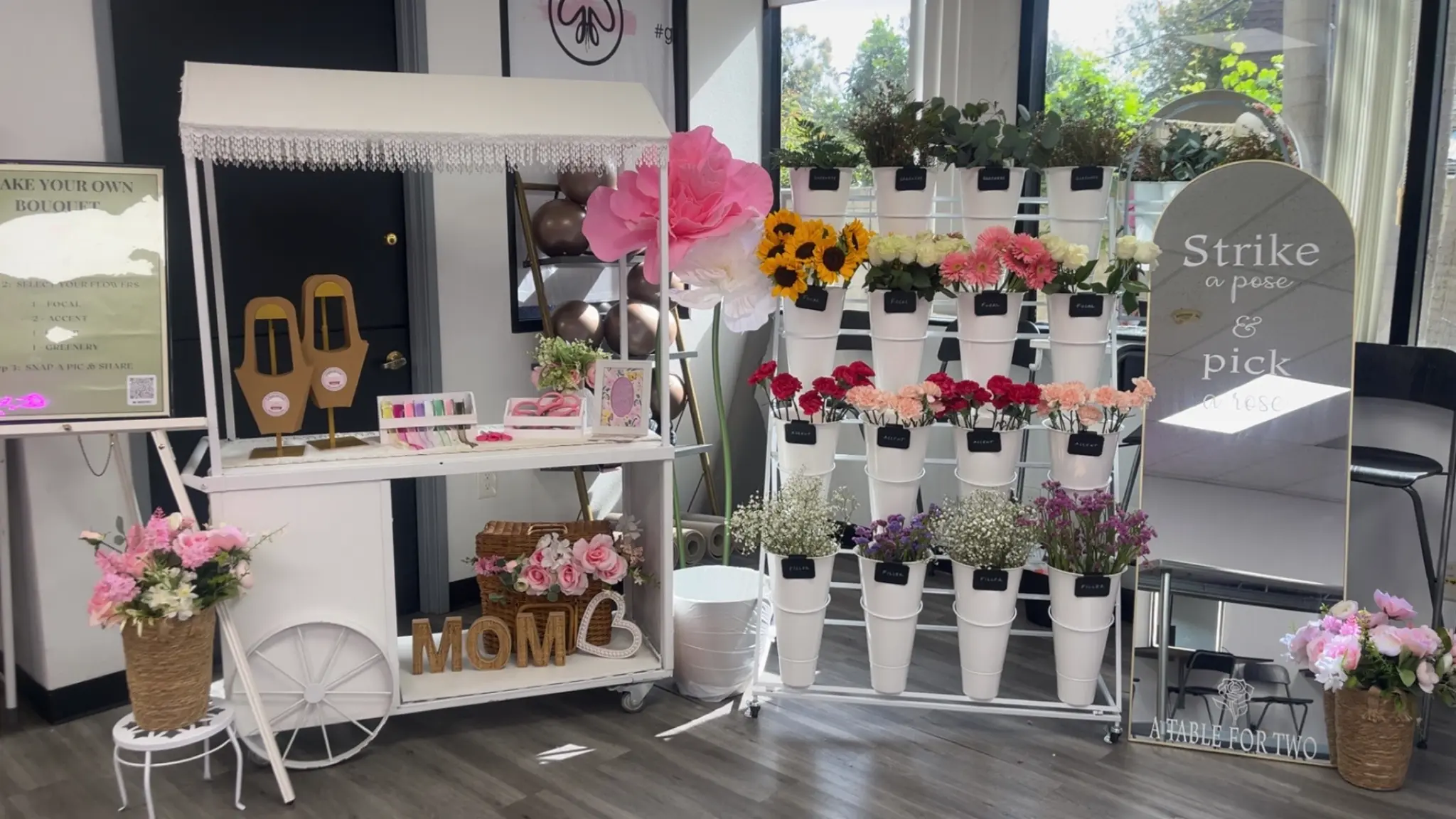 Flower bar with MOM sign and sunflowers for Mother's Day